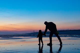 Father and son at low tide.