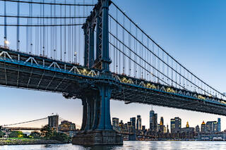 Manhattan Bridge in front of the Brooklyn Bridge.