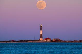 Pink supermoon over the Fire Island Lighthouse.